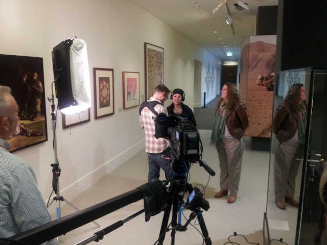 Fatima filming in front of the "Besieged" artwork on display at the Australian War memorial